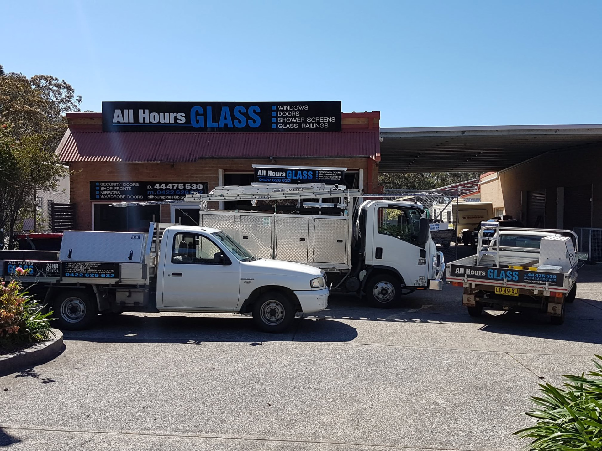 All Hours Glass shopfront in the Shoalhaven with the glazing work utes parked out front