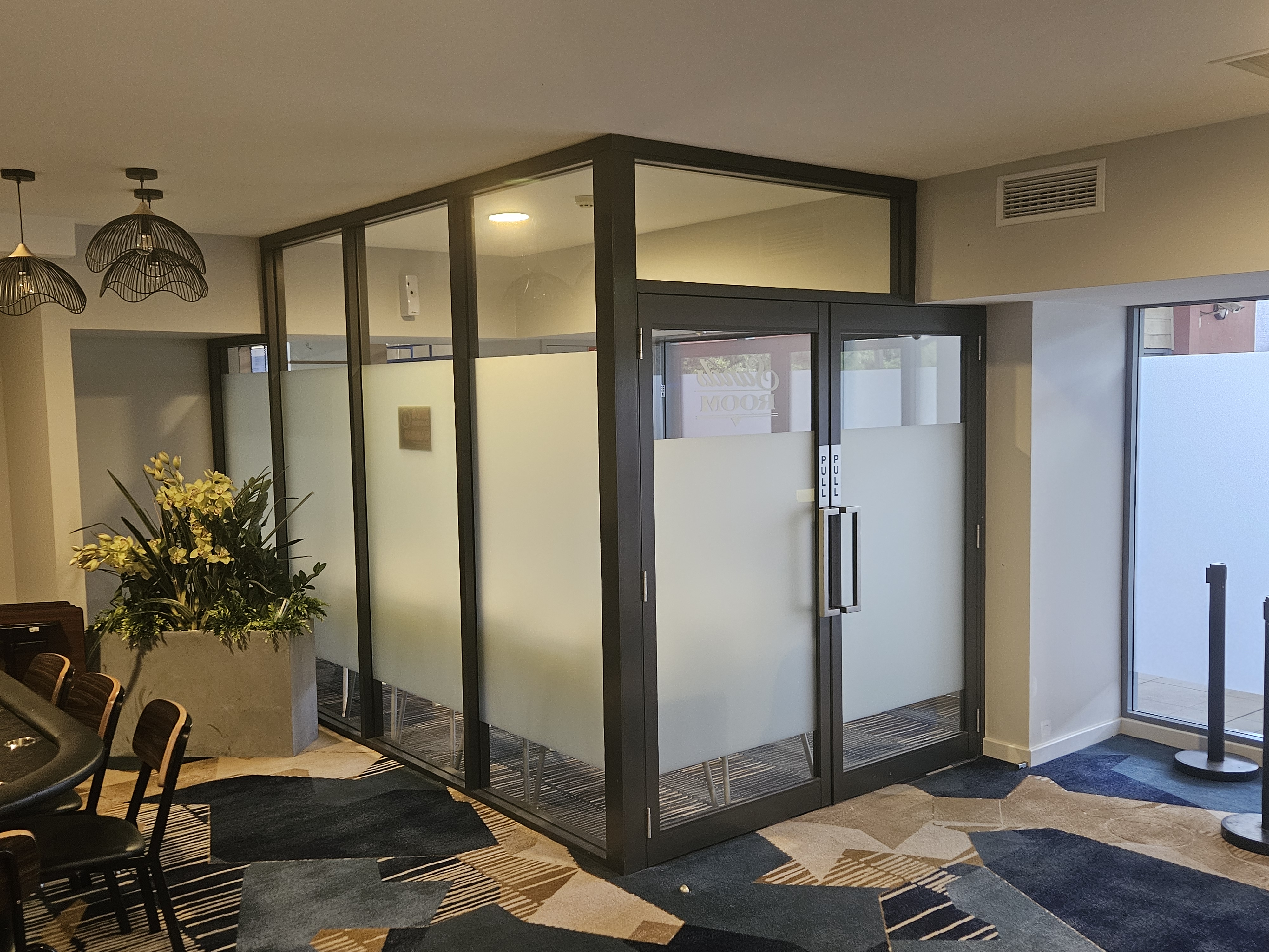 Frosted glass partition and glass entry doors in a Shoalhaven club fitted by All Hours Glass