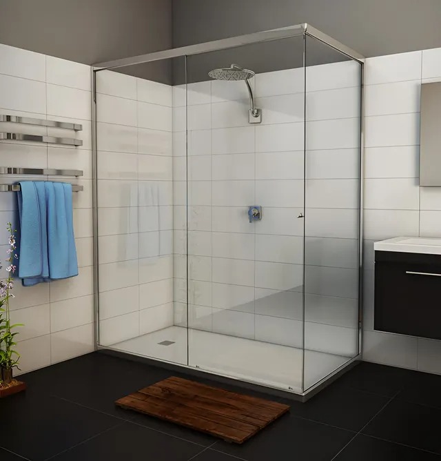 Semi-frameless glass shower screen with a low-profile base in a tiled bathroom