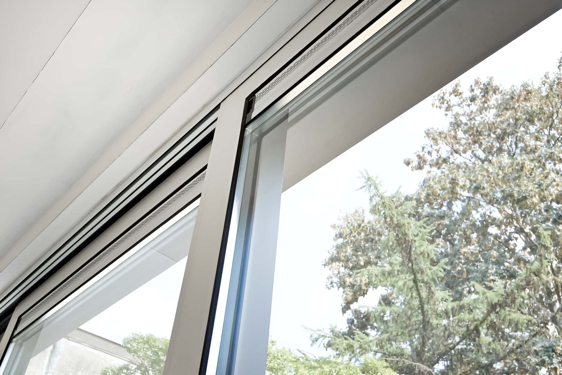 Close-up of a newly glazed sliding window and door track in a Shoalhaven home